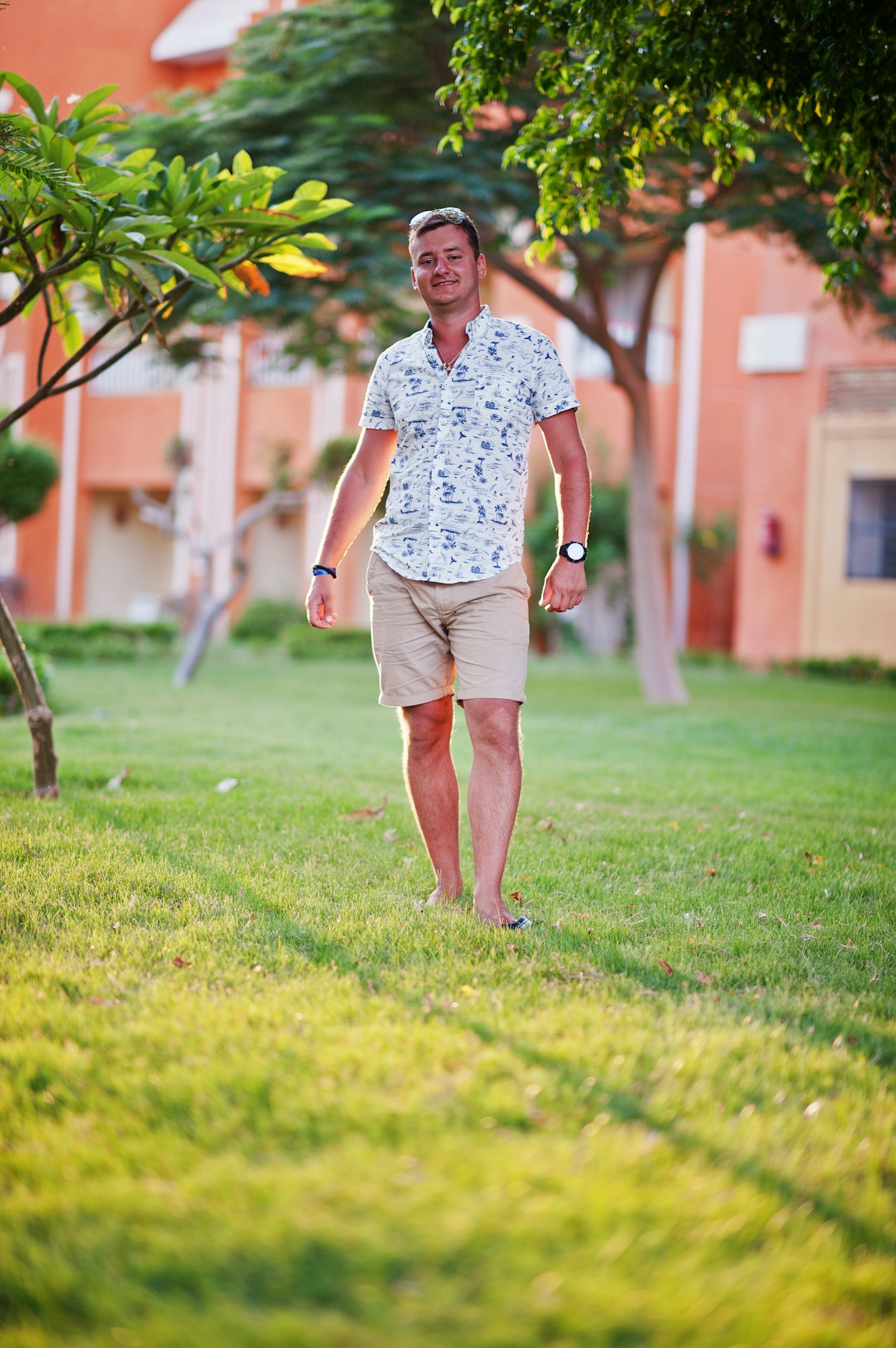 Young man at garden of egyptian resort.
